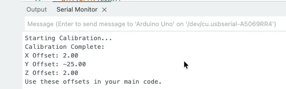 ADXL345 calibration values are printed on the serial monitor of the Arduino IDE. The sensor is connected via I2C.