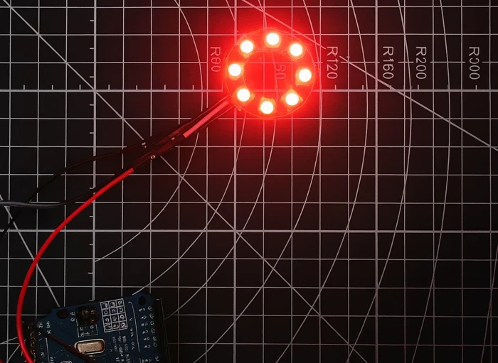 Image shows all 8 LEDs glowing in solid red color on the WS2812 ring, connected to Arduino.