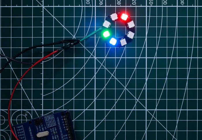 Image shows LEDs 0, 3, and 7 glowing in green, red, and blue respectively on ws2812 ring, connected to arduino.