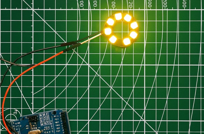 Image shows all 8 LEDs glowing in bright yellow in ws2812 ring, connected to arduino.