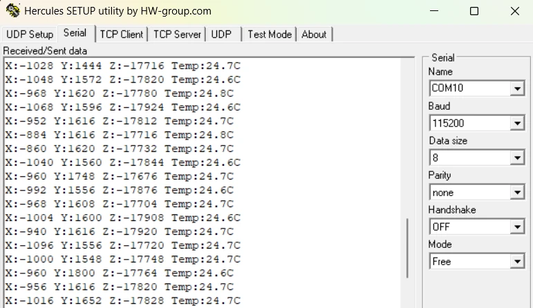 Serial terminal displaying continuous stream of accelerometer X, Y, Z values and temperature in Celsius updating every 500ms