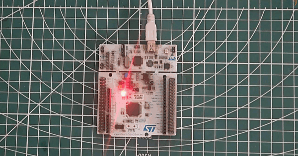 Nucleo-F446RE STM32 board with green onboard LED lit during blink test connected via USB ST-Link