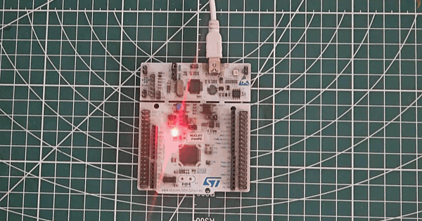 STM32 Nucleo-F446RE board showing LED ON for 500ms and OFF for 2 seconds blink pattern during WritePin test